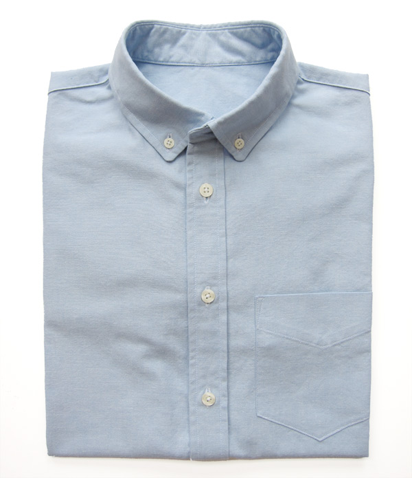 blue oxford cloth button down folded shirt