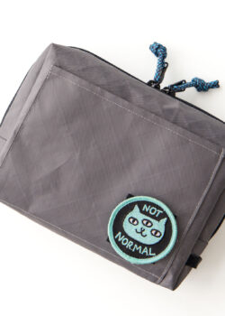 Closed pouch angle 1: Earl Grey EDC box pouch sewing pattern in grey fabric, front view