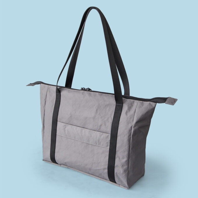 Tess Tote sewing pattern, back view showing full exterior, suitcase handle pass through, and handles