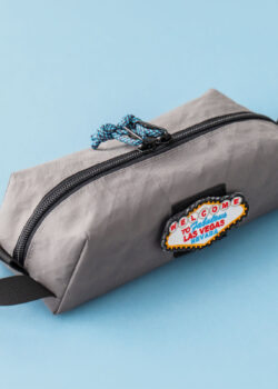 Closed pouch angle 1: Livingston slim EDC box pouch sewing pattern in grey fabric, angled view
