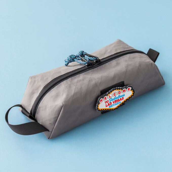 Closed pouch angle 1: Livingston slim EDC box pouch sewing pattern in grey fabric, angled view